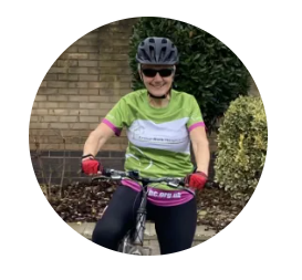 Female on a bike in green t-shirt