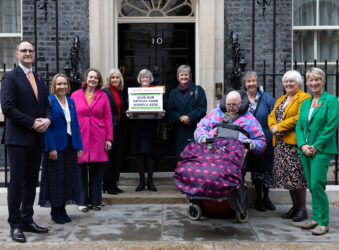 Males and females outside 10 Downing Street in London