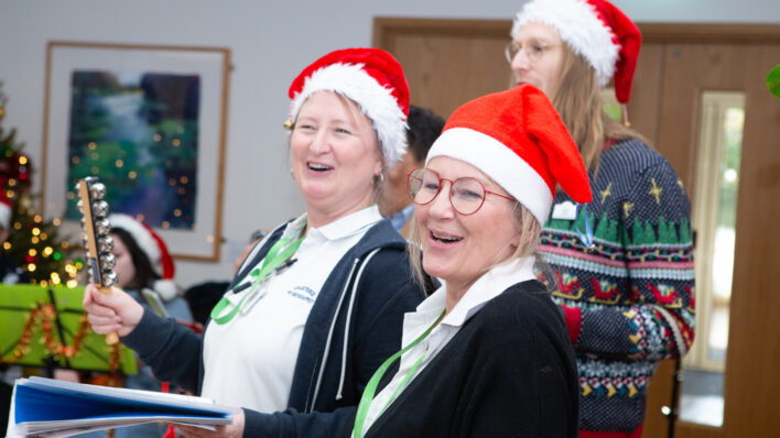 Nurses wearing red santa hats