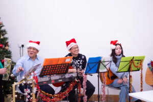 Male and female with red Santa hats