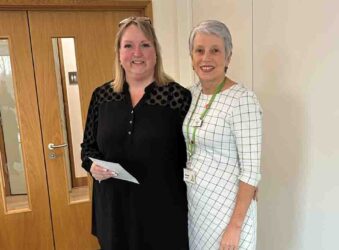 2 females with an award