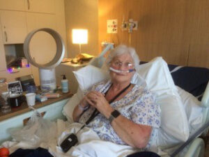 Female in bed with oxygen