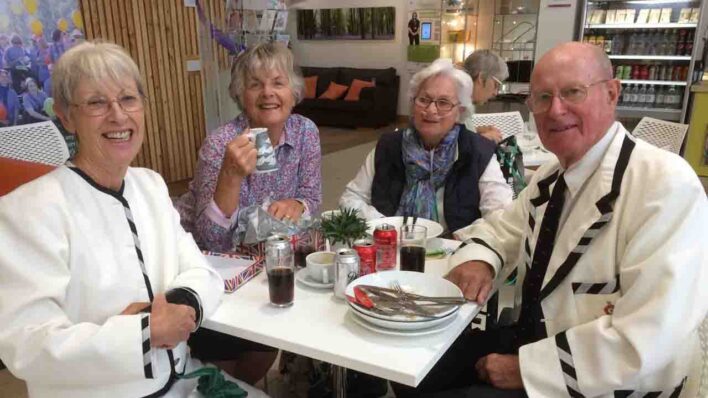 3 Females and 1 male sitting at a table