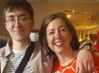 Man with glasses and woman, smiling