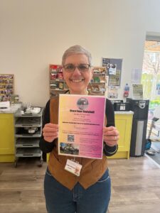 Female holding a poster