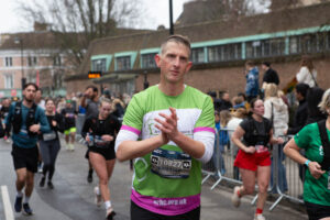 Male in green running