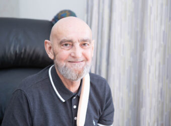 Male smiling at the camera