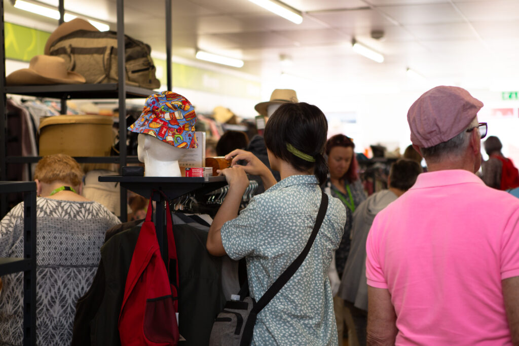 Two males looking at clothes