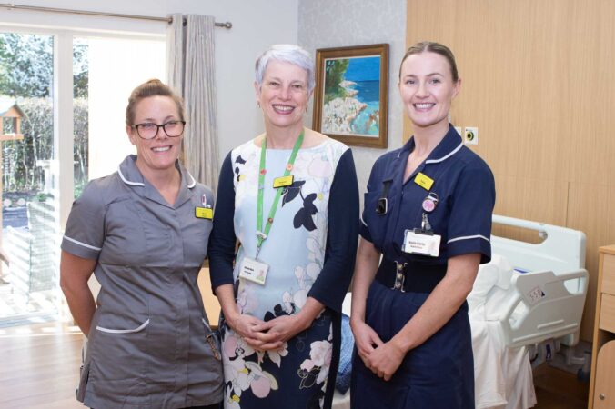 Three females, two in nurse uniforms