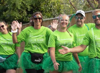 Male and females dressed in green