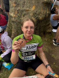 Female holding medal 