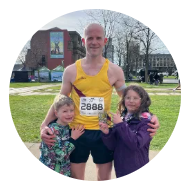 Male in running vest with two children 