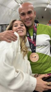 Male holding medal 