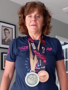 Female holding medal 