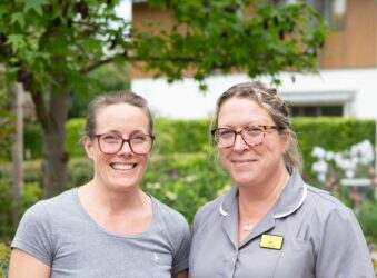 2 female nurses in the garden