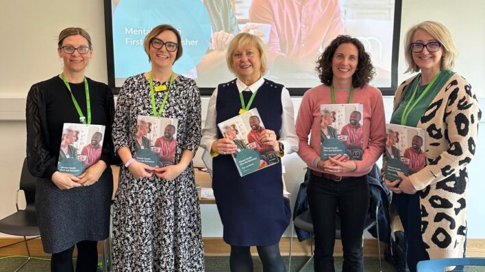 Five females holding folders