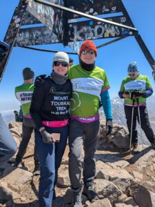 Male and female at the top on a mountain