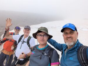 Males on a snowy mountain