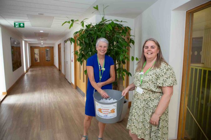 2 Females with a big grey tub and small ticket