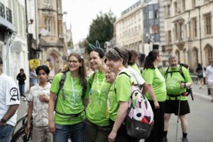 Females wearing green t-shirts and lights