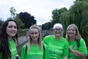 4 females in green t-shirts