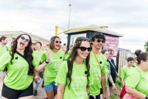 Male and females in green t-shirts