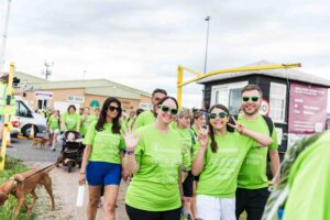 Male and females in green t-shirts
