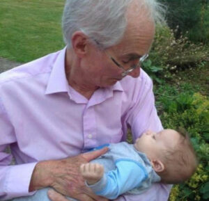 Male holding a baby