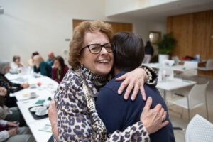 2 females hugging