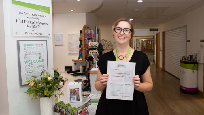 Female holding a certificate