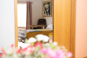 Bed in a room with a view to the garden