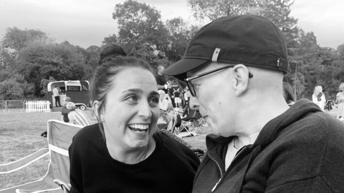 Two females smiling outside