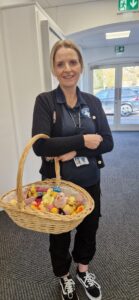 Female holding a basket of knitted chicks