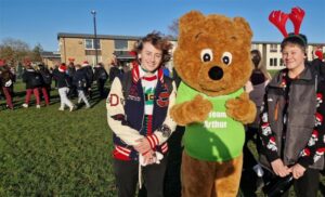 Students and a life sized bear