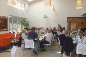 Males and females sitting at tables