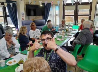 Male and females around a table