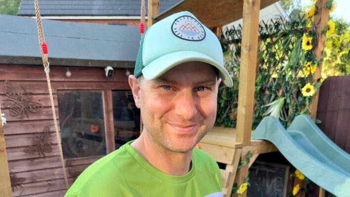 Male wearing a green T-shirt